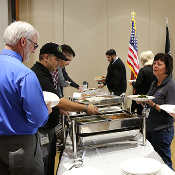Veteran employees in line at the lunch buffet