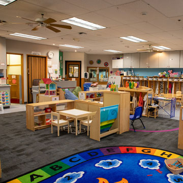 Pre-Kindergarten Classroom, showing different learning areas including block, writing, and dramatic play. 