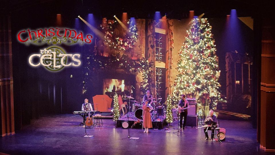 The Celts performing on a stage that is decorated for Christmas, next the words Christmas with the Celts